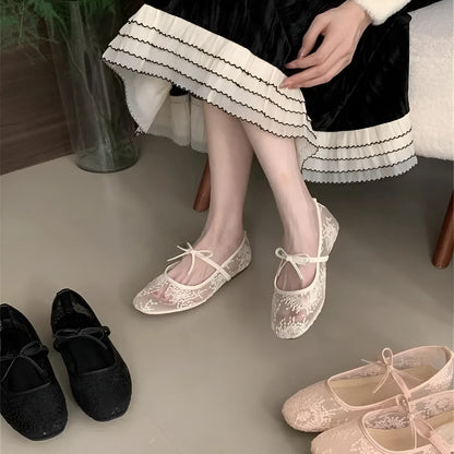Pink Mary Jane evening shoes with flat lace, mesh upper, and a mid heel on a rubber sole.