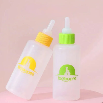 Set of four coloured pet milk bottles with silicone teats and a cleaning brush for small animals.