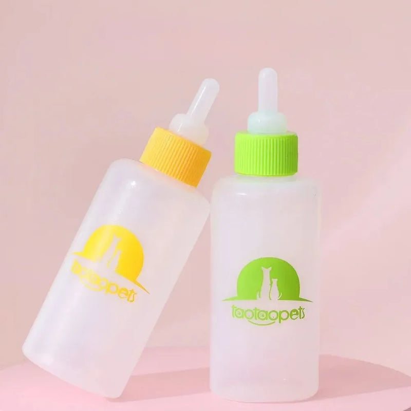 Pet milk bottle feeding kit for small animals, newborn puppies and kittens, including 4 plastic and silicone bottles with cleaning brush in colours blue, green, pink and yellow, measuring 10cm x 3cm x 7cm and weighing 37g