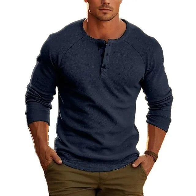 Men's white long-sleeved t-shirt with a Henry collar laying flat