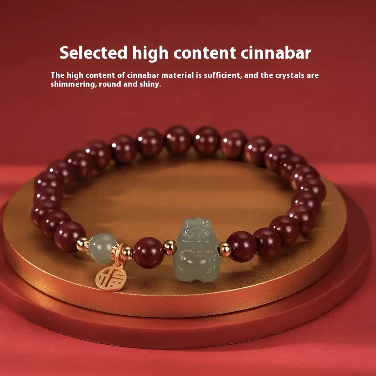 Natural Hetian jade bracelet with zodiac carvings and cinnabar accents in 8mm diameter
