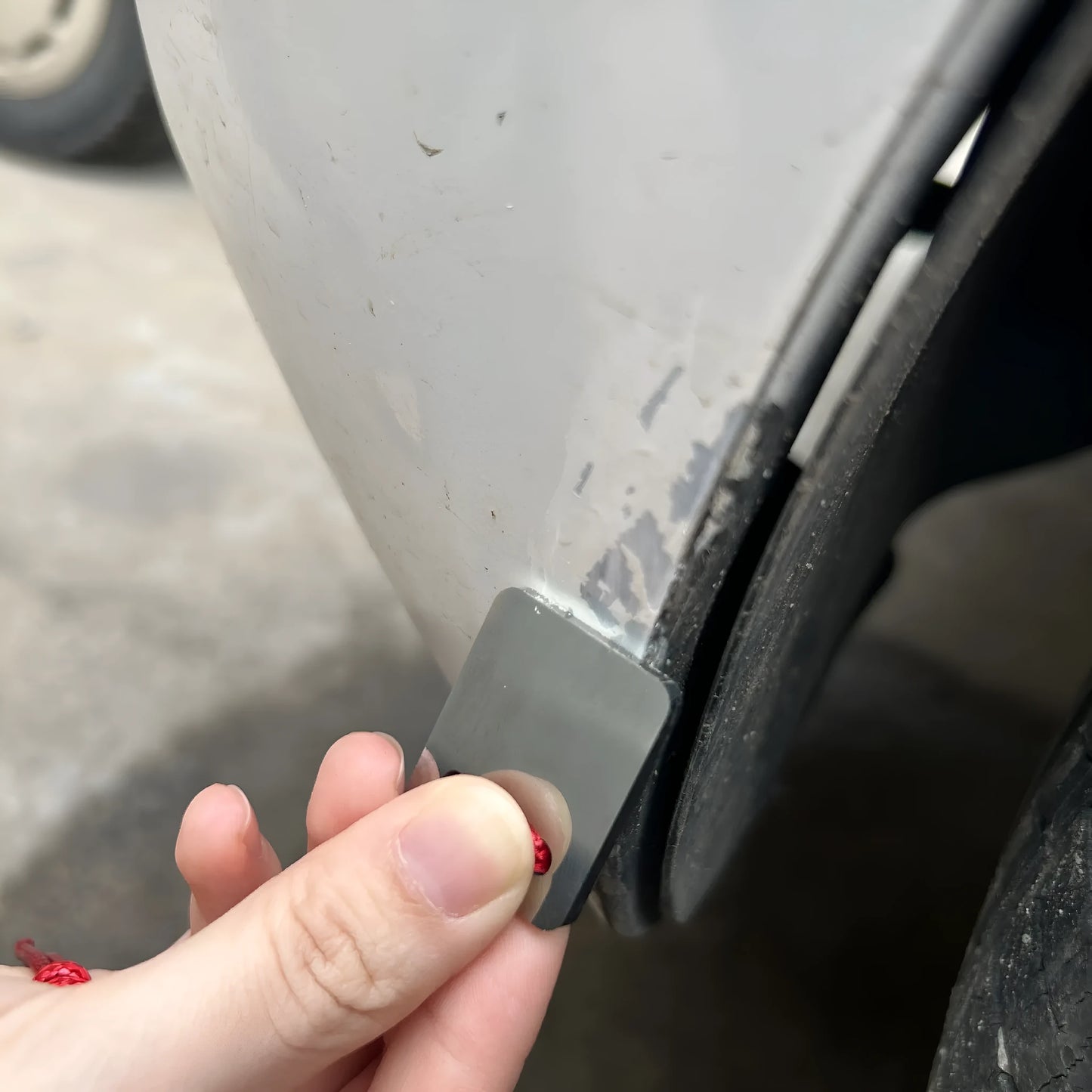 Silver metal car paint scraper for removing chips and scratches from automotive bodywork