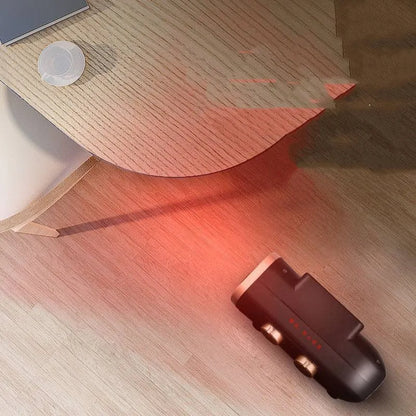 White electric heater fan with mechanical dial controls on a wooden floor.