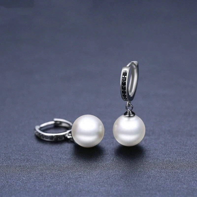 Stylish black round ball stud earrings for women, minimalist design, durable copper construction.