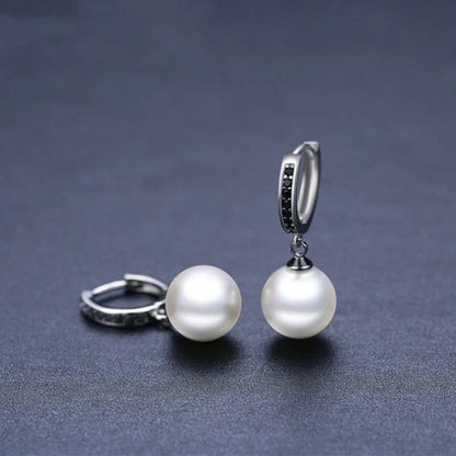 Stylish black round ball stud earrings for women, minimalist design, durable copper construction.
