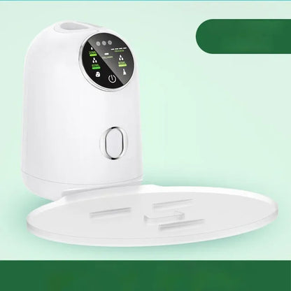 White plastic homemade face mask maker with tray, scraper, measuring cup, 32 effervescent tablets, and power cord.