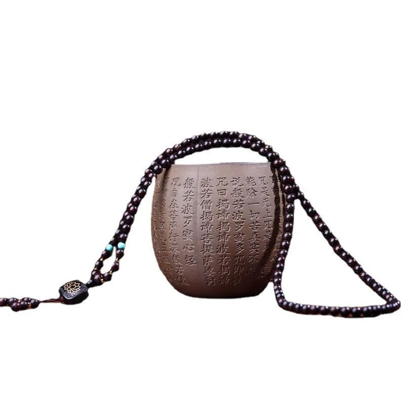 Zambia rosewood bead bracelet with 108 beads and flat lotus pendant on wooden surface