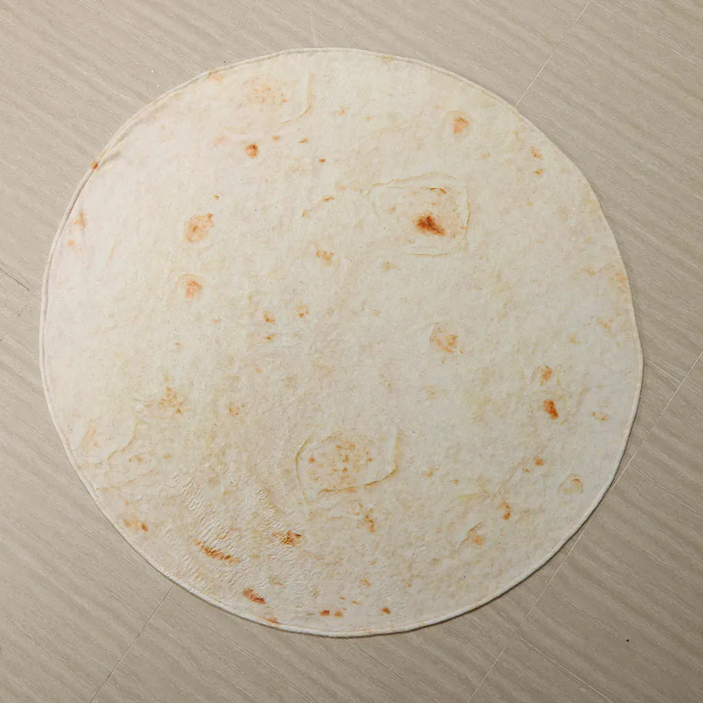 Round flannel burrito blanket with food-themed printing, showing coral fleece texture and wrap-style design