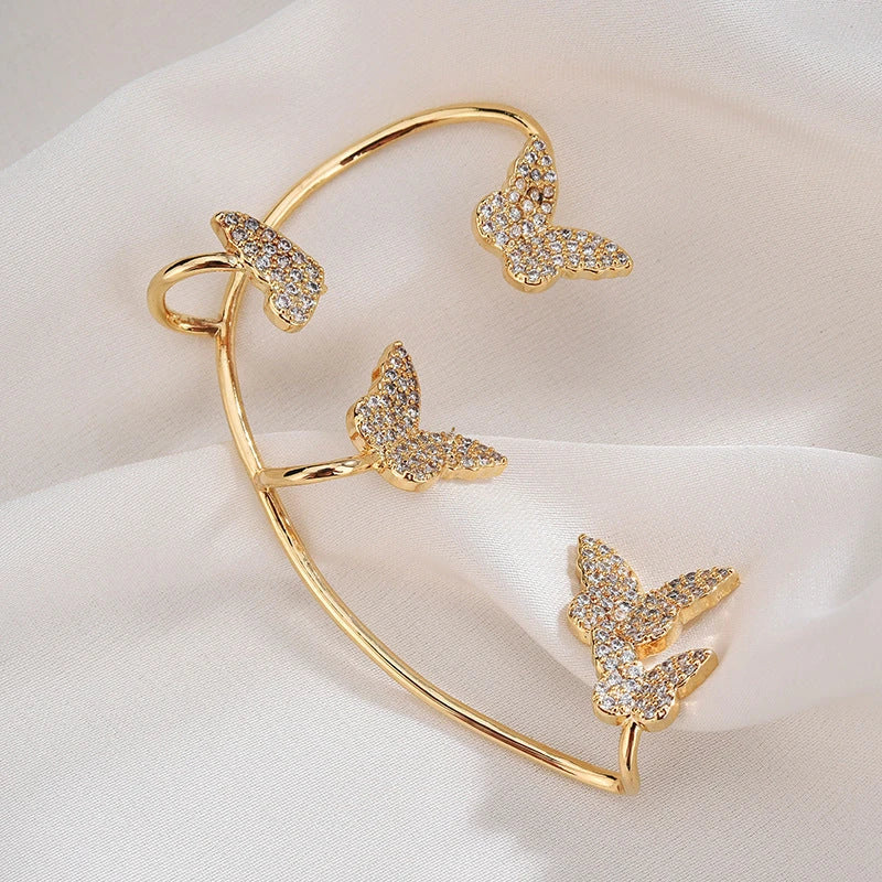 Elegant gold-plated butterfly ear cuffs with sparkling zircon accents, perfect for women's fashion and accessorizing