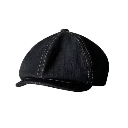 Black Japanese denim cotton beret hat showing octagonal cap style on neutral background