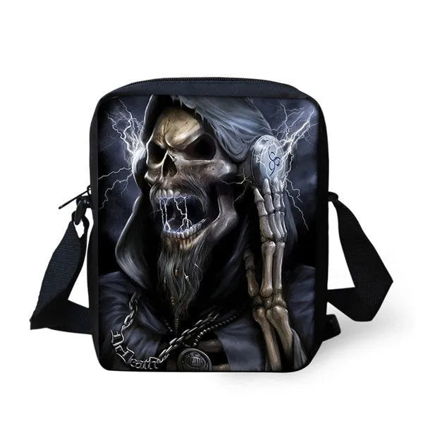 Skull print children's messenger bag with adjustable double straps and zipper closure, shown in a casual setting.