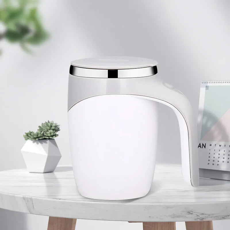 White automatic stirring coffee cup with magnetic mixing technology and modern design