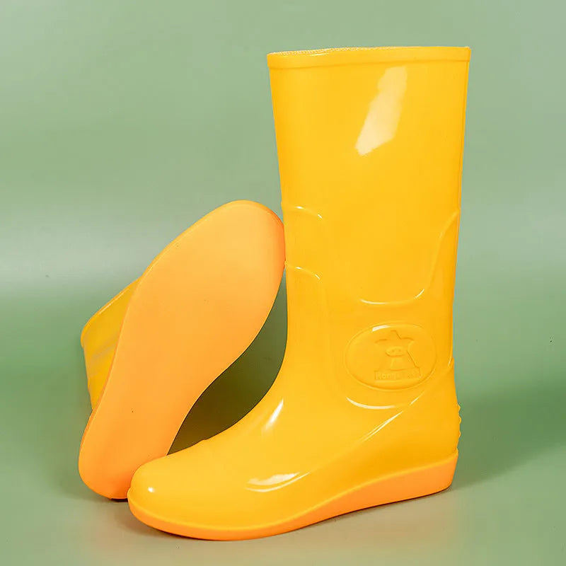 Plastic washable rain boots in white and yellow colours showing high tube Wellington-style design