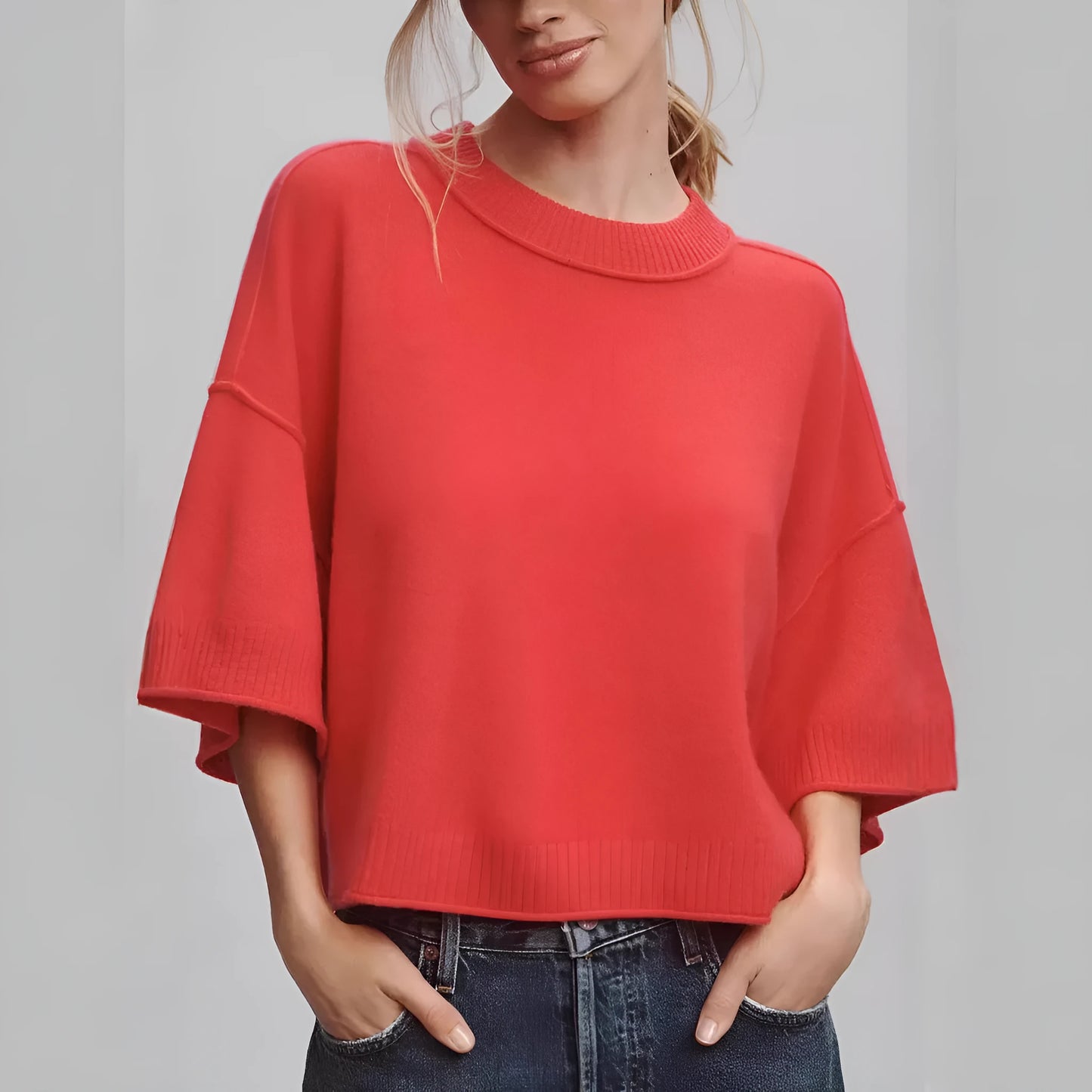 Women's red short sleeve viscose T-shirt with an exposed navel cropped design on a model.