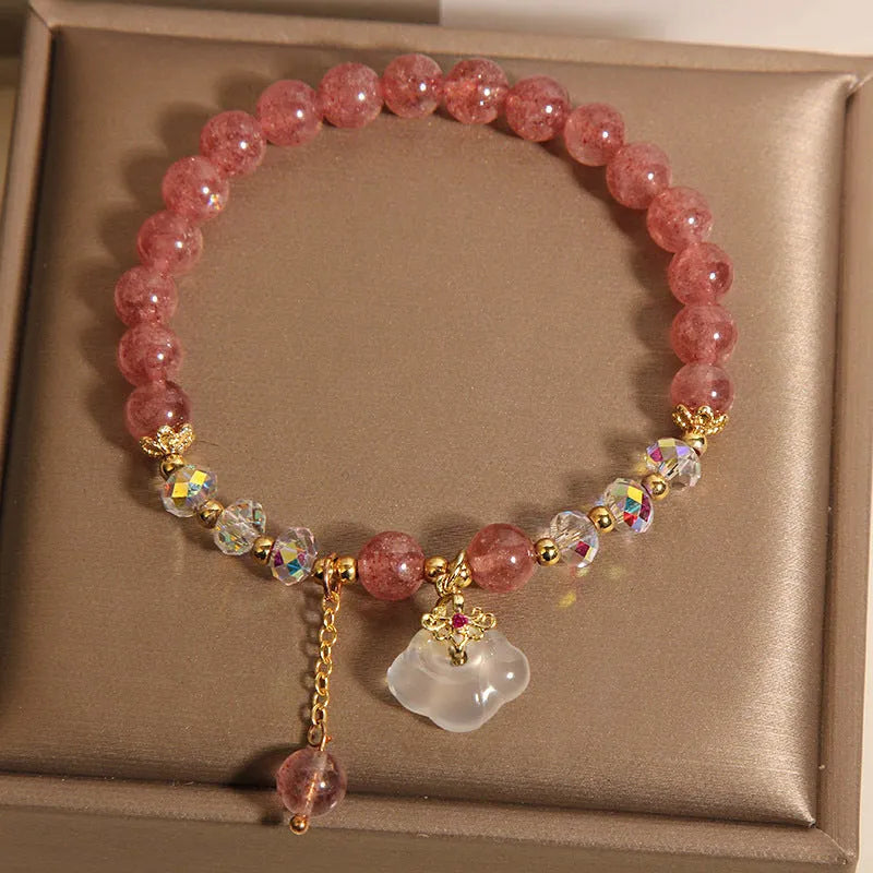 Women's strawberry quartz and white agate crystal bracelet with auspicious cloud charms on elasticated cord