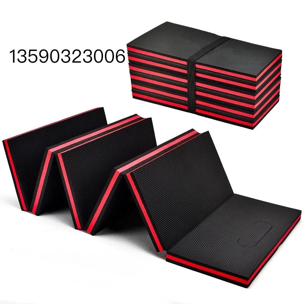 Green EVA foam folding kneeling mat unfolded on a garage floor