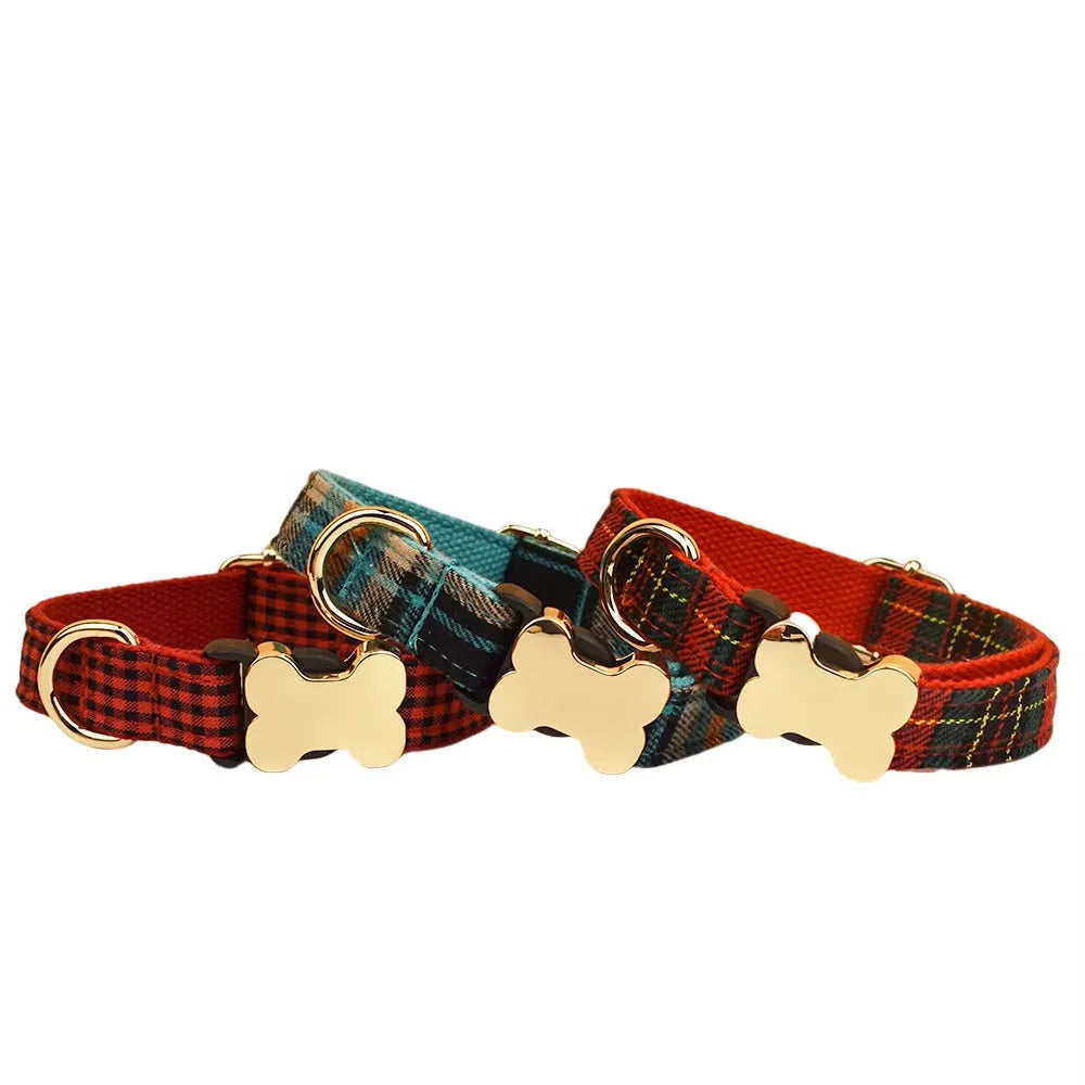 Flat nylon grid print dog collar with a white plastic bone-shaped buckle on a green background.