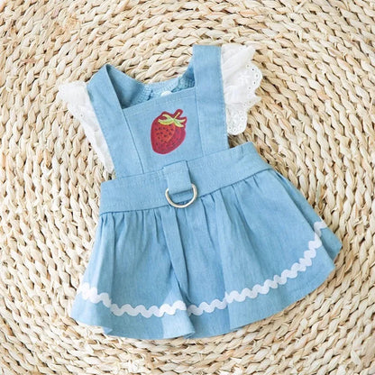 Strawberry print denim-style dog skirt in Bondi Blue colour on a small dog