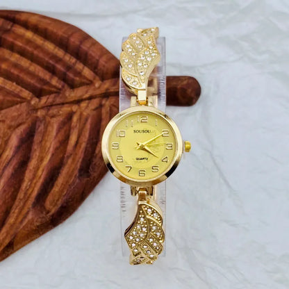 Stainless steel women's watch with round dial and vachette clasp on wrist.