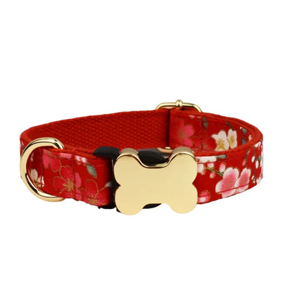 Flat nylon grid print dog collar with a white plastic bone-shaped buckle on a green background.