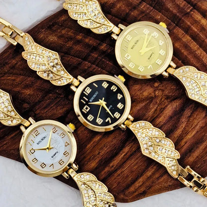 Stainless steel women's watch with round dial and vachette clasp on wrist.
