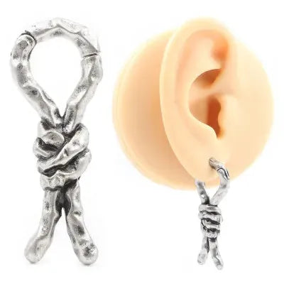 Close-up of 4mm copper earrings with a bending, hitch design for cartilage piercings.