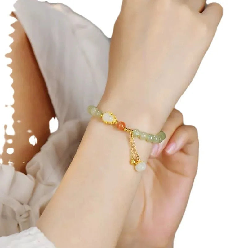 Qingshui jade women's bracelet with gold gourd charm and fu character, 6mm gold plated beads