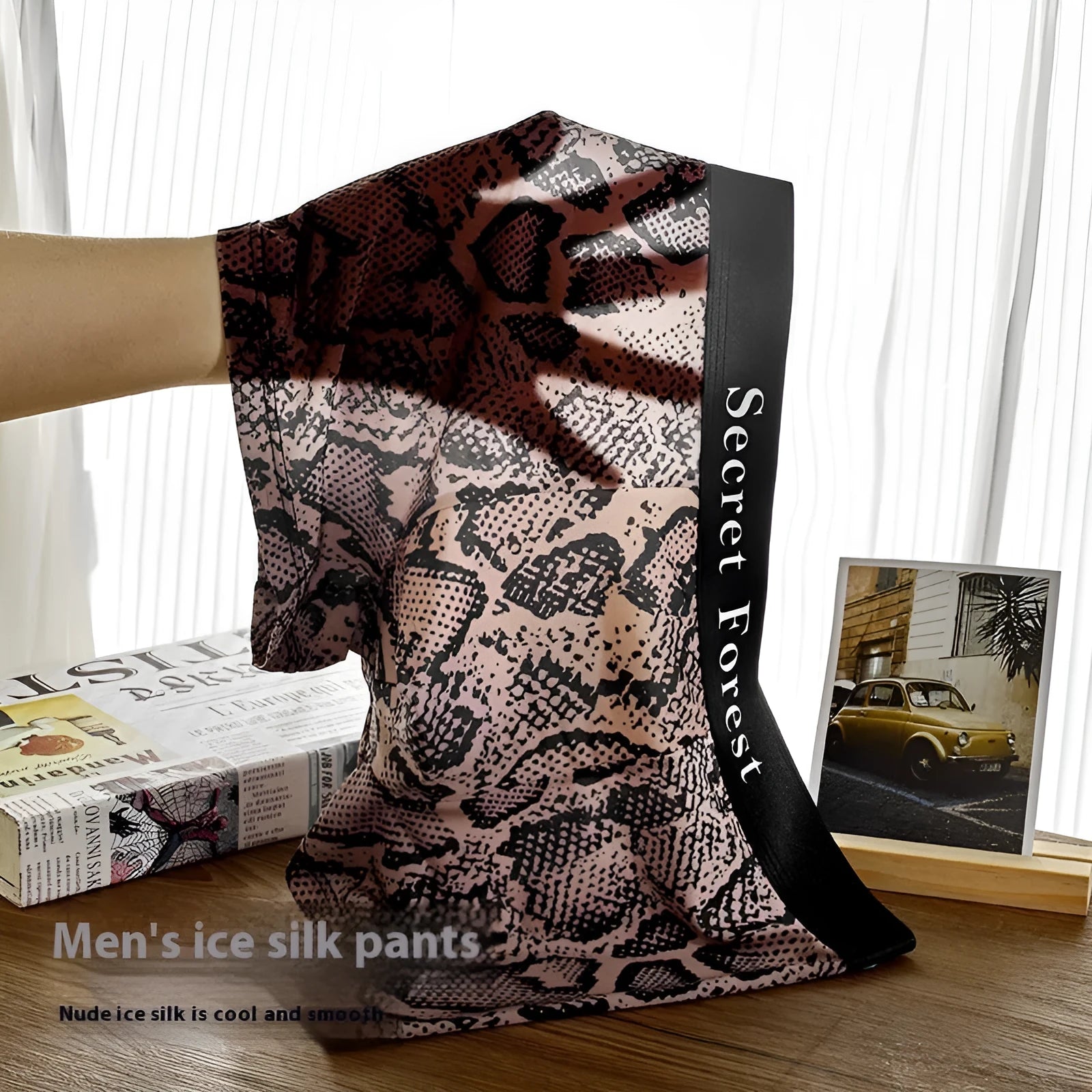 Men's loose fit polyester boxer shorts in black colour showing mid-waist design