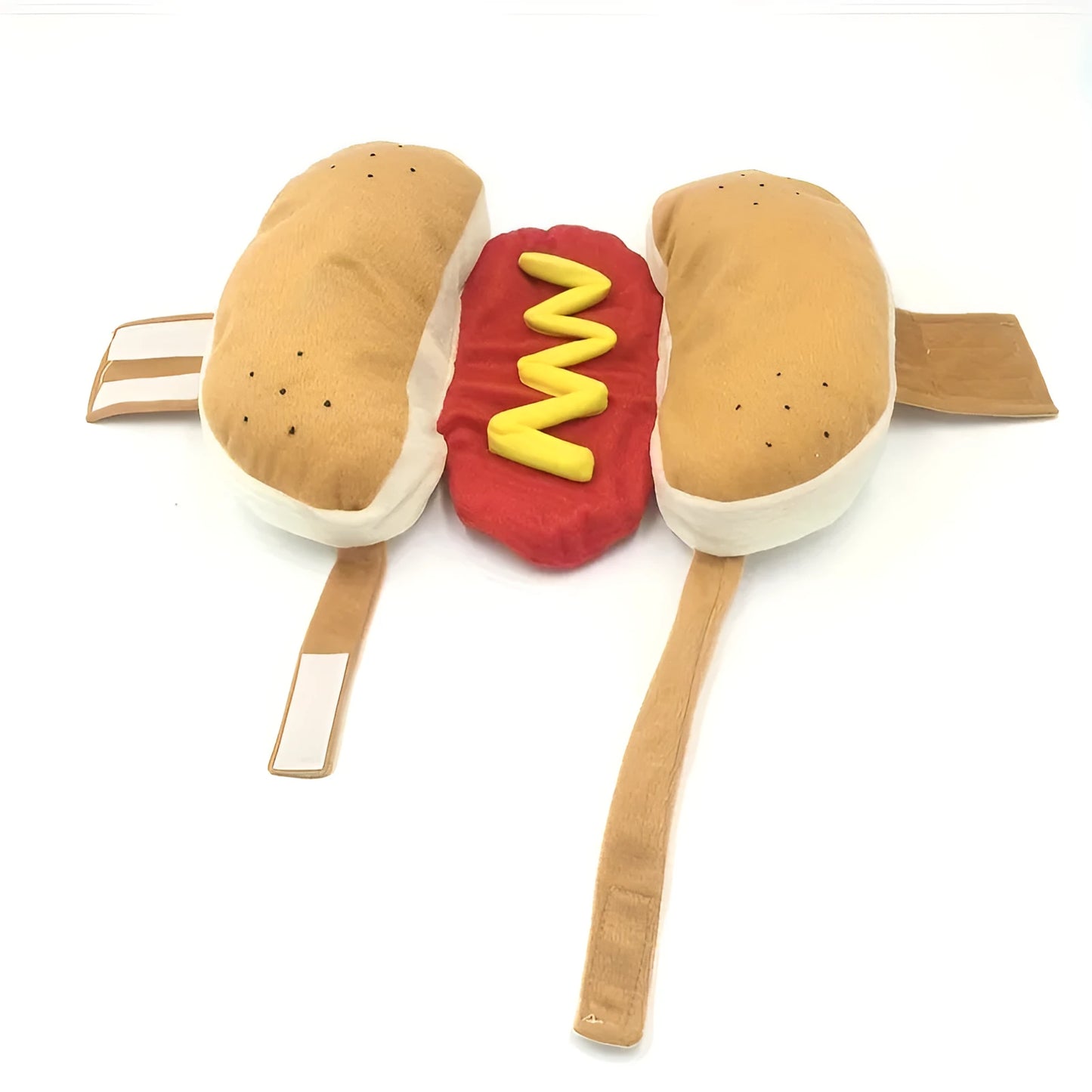 Small dog wearing a humorous stuffed hot dog costume suit in a winter setting.