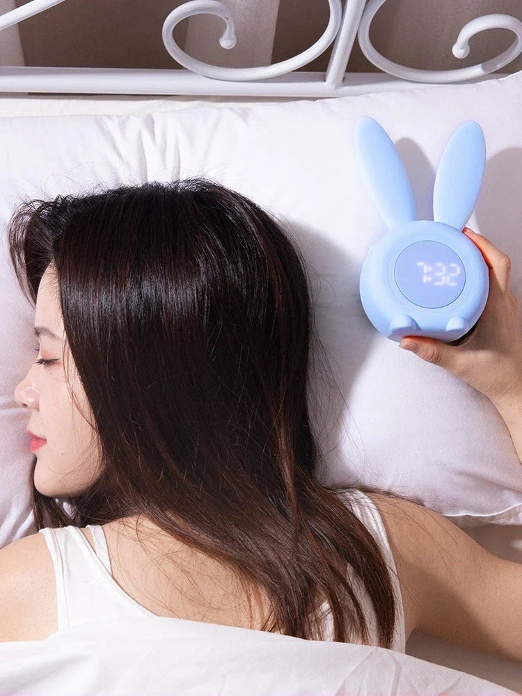 Adorable bunny-eared digital alarm clock with LED display, sound control, and magnetic design