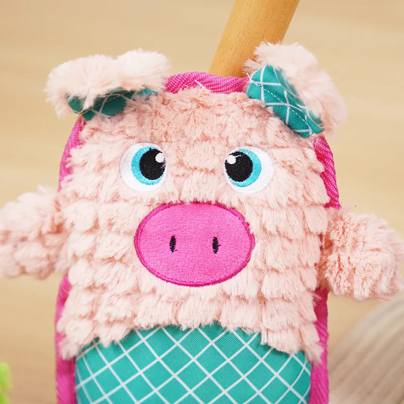 Blue, green, and pink stuffed plush dog toys with squeakers for bite-resistant chewing.