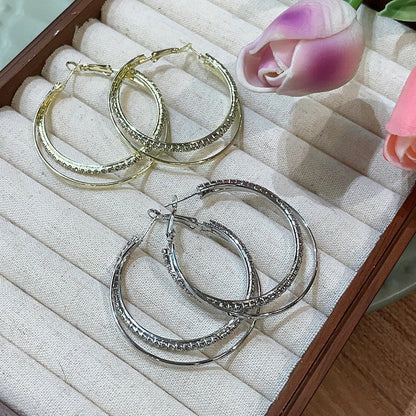 Elegant geometric metal earrings for women in gold and silver finishes