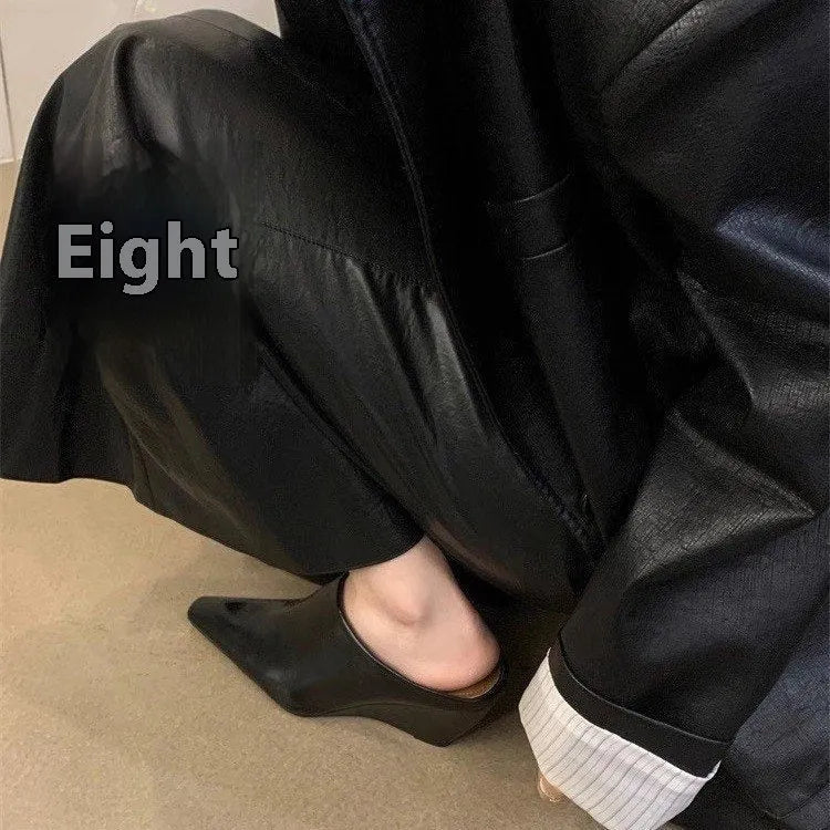 Women's black wind wedge closed toe half slippers showing PU upper and open back.
