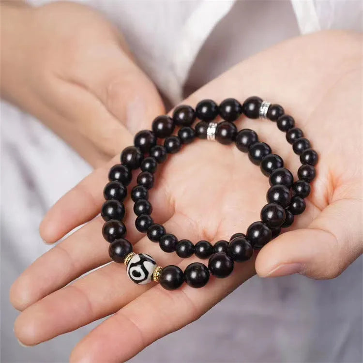 Tibet beads ebony bracelet in 8mm size featuring two ebony circles with retro design elements suitable for men and women seeking unisex wooden jewellery