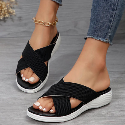 Black women's flat wedge slippers with a peep-toe fish mouth design and thick rubber sole