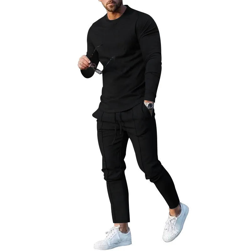 Men's solid colour two-piece lounge suit with long sleeve T-shirt and trousers in light grey.
