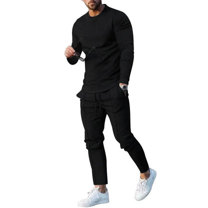 Men's solid colour two-piece lounge suit with long sleeve T-shirt and trousers in light grey.