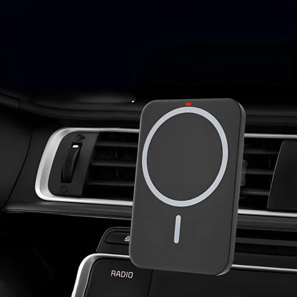 Black car magnetic wireless charging bracket mounted on air vent with phone attached