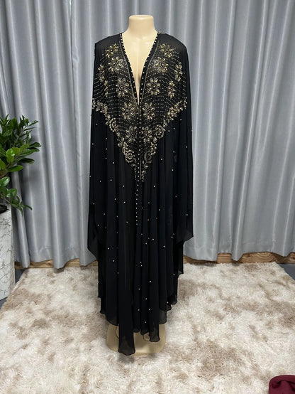 Purple chiffon Muslim style shawl with rhinestone beaded trim laid flat showing its long length.