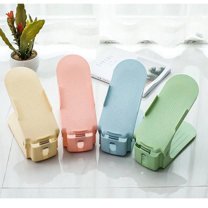 A stackable plastic shoe storage cabinet with two open shelves, shown in a choice of colours.