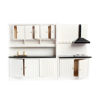 White dollhouse kitchen sink and stove cabinets with working doors and metal handles.