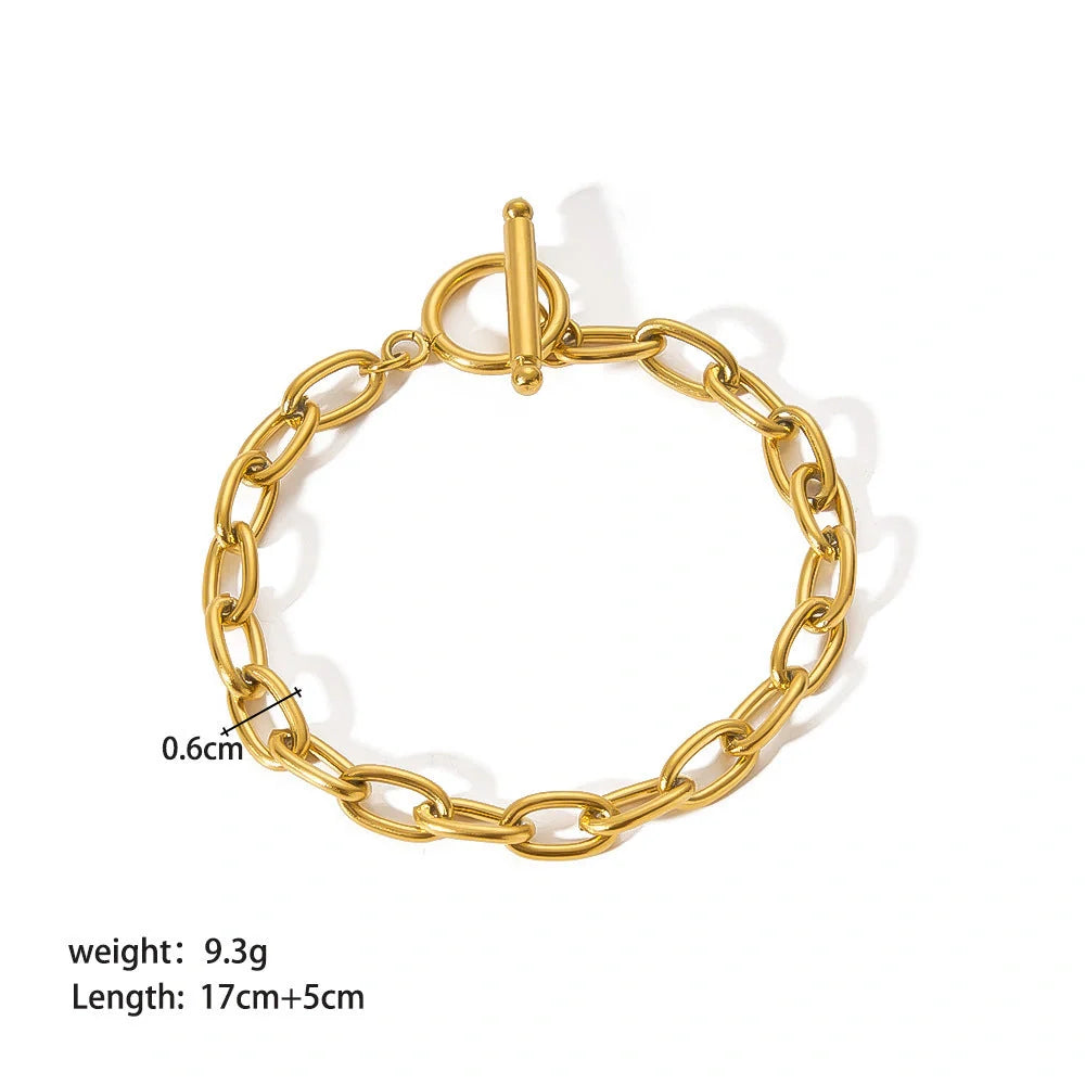 Elegant stainless steel bracelet with a sleek geometric design, gold-plated finish, and unisex style suitable for any occasion.