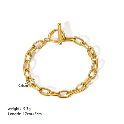 Elegant stainless steel bracelet with a sleek geometric design, gold-plated finish, and unisex style suitable for any occasion.