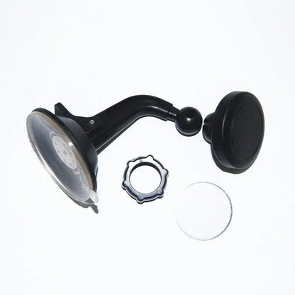 Black magnetic car phone holder with rotating head shown mounted on dashboard