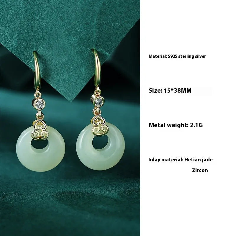 Chinese style sterling silver and Hetian jade jewellery set with bracelet, necklace, and earrings.