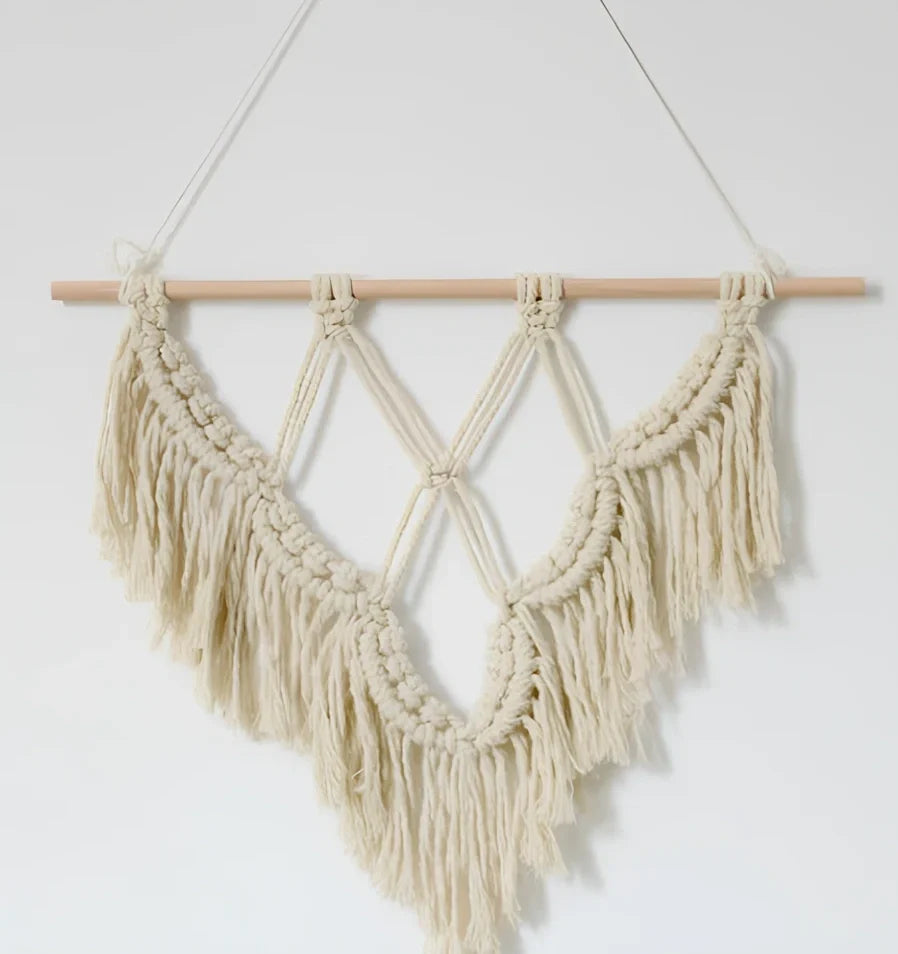Handmade boho macrame wall hanging in pink cotton rope, 40cm high 50cm wide with wooden rod and natural seeds