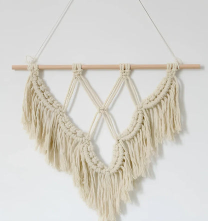 Handmade boho macrame wall hanging in pink cotton rope, 40cm high 50cm wide with wooden rod and natural seeds