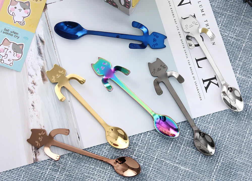 Stainless steel coffee spoon with cartoon cat handle showing hanging hole and smooth edges