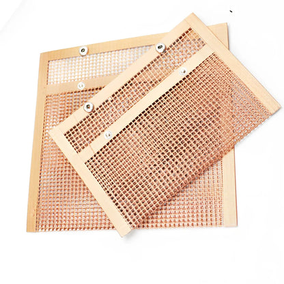 Black grill mesh bag with non-stick grid mat for BBQ cooking showing smoke-through design