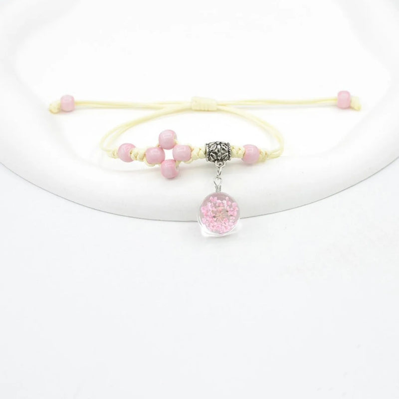 Glass dried flower bracelet with real flowers, a hand-woven beaded jewellery piece featuring a 1.4cm diameter bead, available in colours including white, red, pink, blue, and purple for women's cute style accessories.